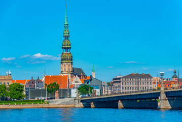 the old town of riga including saint peters church viewed over daugava river, Latvia.