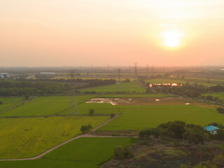 Fototapeta premium Aerial view of electricity generating, voltage poles. Power lines on utility tower and cable wires in energy electric technology, network, and industry. Generator pylon. Transmission and substation.
