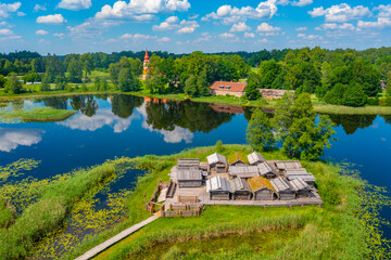 Aerial view of wooden houses at Araisi lake dwelling ethnographic site in Latvia