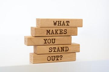 Wooden blocks with words 'What Makes You Stand Out?'.