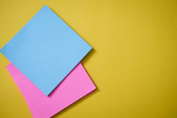 Colorful sticky notes on yellow background	
