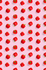 Bulgarian red ripe pepper on pink backdrop. background from paprika, flat lay not seamless pattern