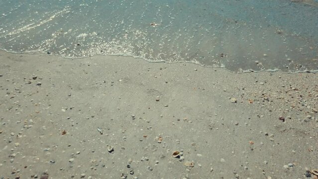 Seashore Gentle Waves Against Sandy Beach     