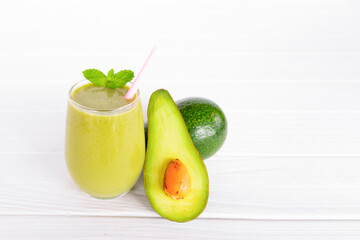Avocado fresh cocktail smoothies fruit juice beverage healthy the taste yummy in glass drink episode good morning on wooden background.
