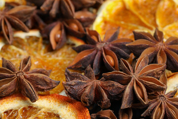 Dry orange slices and anise stars as background, closeup