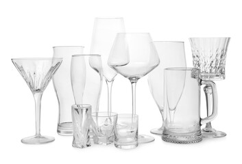 Different elegant empty glasses isolated on white