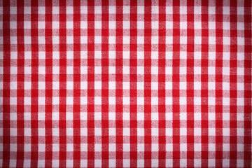 Red and white tablecloth as background, vignette effect