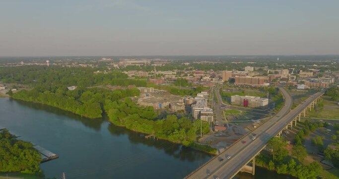 Aerial Panning Shot Of Cars Moving On Bridge Roads In City Against Sky During Sunny Day - Tuscaloosa, Alabama