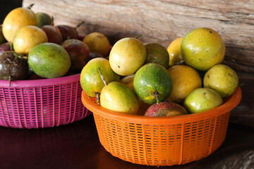 Close-up of passion fruit in the basket at local market. Sale of fruit in the market.
