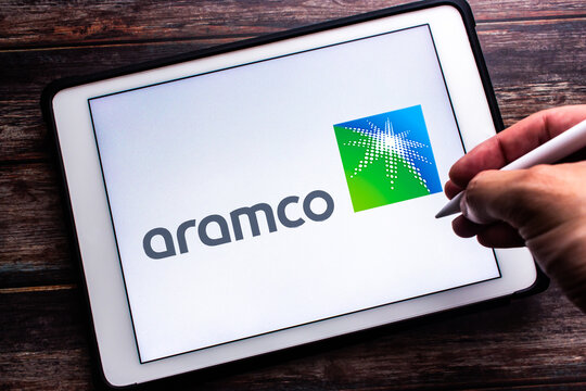 Vancouver, CANADA - Mar 28 2023 : Logo of Saudi Aramco, a Saudi Arabian public petroleum and natural gas company based in Dhahran, seen in an tablet. Man hand holding wireless stylus