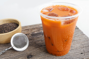 Thai Milk Tea or Milk ice tea, A glass of ice milk tea. It is popular in Thailand and is served in many restaurants. Iced tea (called Cha Yen in Thailand)