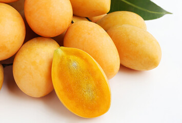 Fototapeta na wymiar Fresh Marian Plum, (Bouea macrophylla Griffith), Ripe plum mango on white background.