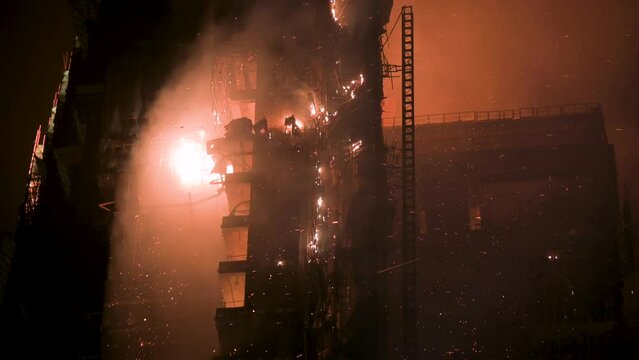 View of flames from a fire breaking out at a high-rise skyscraper office building in Hong Kong.