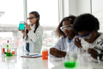 Group of teenage student learn science and study doing a chemical science experiment, biology...