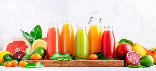Poster Summer beverages. Citrus fruit juices, fresh and smoothies, food background. Mix of different whole and cut fruits: orange, grapefruit, lime, tangerine with leaves and bottles with drinks, banner © 5ph