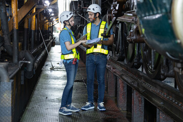 Fototapeta premium Engineer train Inspect the train's diesel engine, railway track in depot of train