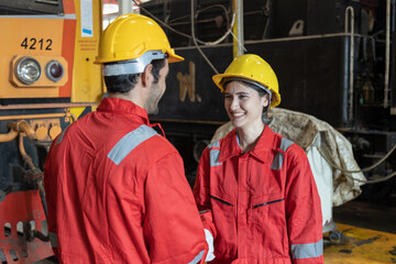 Engineer train Inspect the train's diesel engine, railway track in depot of train
