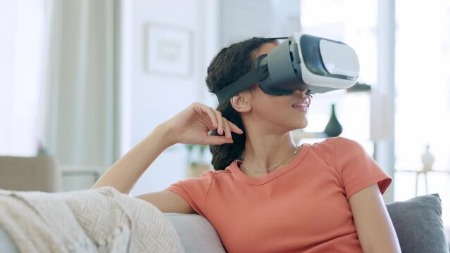 VR goggles of happy woman on sofa in metaverse, futuristic video games and cyber punk 3d experience at home. Virtual reality, digital high tech and young biracial person or gamer with gaming vision