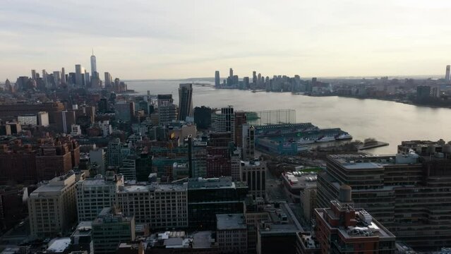 Aerial view over buildings, overlooking the Chelsea cityscape and the Hudson river, sunset in NY