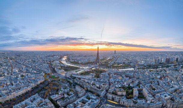 Beautiful view of famous Eiffel Tower in France with colorful twilight romantic sky. Wide establishing aerial morning sunrise or sunset of paris city center best travel destinations landmark in Europe