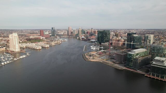4K aerial. Distant skyline clip of downtown Baltimore, Maryland and Patapsco River.