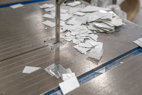 machine blade with cut scrap metal