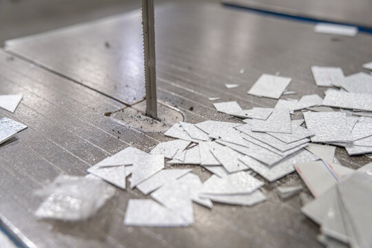machine blade with cut scrap metal