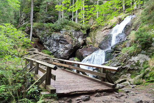 Wooden Bridge And Waterfall Rieslochfälle In Bavarian Forest Near Bodenmais, Germany