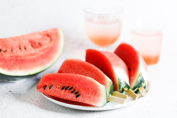 Watermelon slices with stick.