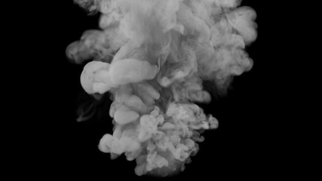 The smoke bomb emits a powerful stream of grey smoke.