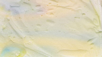 Close-up view of rainbow ice cream that has just been taken out of the container.