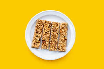 Peanuts butter chocolate bars on white plate