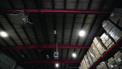 wide shot of roof and top shelfs of warehouse distribution center in USA