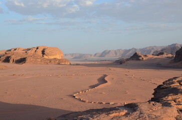Fototapeta na wymiar Beautiful Wadi Rum landscapes from the desert in Jordan with its pink and orange rock formations