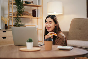 Female entrepreneur working and video conference with colleague