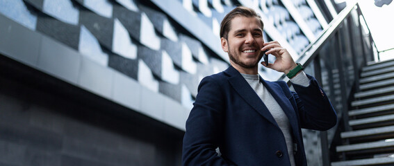 successful young architect on the background of the business center