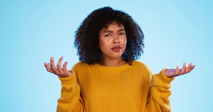 Face, confused and unsure black woman in studio, pensive and dont know gesture on blue background. Doubt, portrait and girl with decision, why or emoji on mockup, puzzled or posing indoors isolated