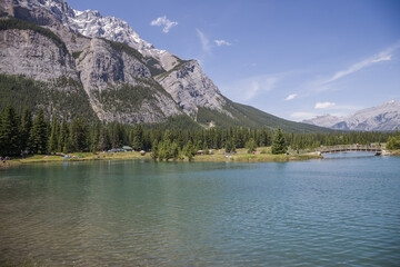 Canada landscape - Banff National Park, Alberta - summer travel to mountains, beautiful blue lake and coniferous forest.