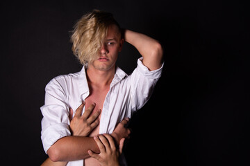 Young attractive couple are hugging. Problems and relationships.