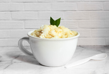 Bubur sumsum. Dessert porridge originating from Java made from rice flour, coconut milk with palm sugar syrup. Popular food during Ramadan. Bubur sumsum is a traditional food from Java