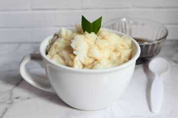 Bubur sumsum. Dessert porridge originating from Java made from rice flour, coconut milk with palm sugar syrup. Popular food during Ramadan. Bubur sumsum is a traditional food from Java
