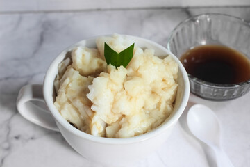 Bubur sumsum. Dessert porridge originating from Java made from rice flour, coconut milk with palm sugar syrup. Popular food during Ramadan. Bubur sumsum is a traditional food from Java
