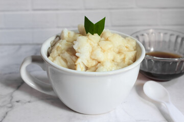 Bubur sumsum. Dessert porridge originating from Java made from rice flour, coconut milk with palm sugar syrup. Popular food during Ramadan. Bubur sumsum is a traditional food from Java