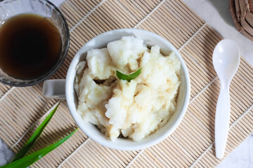 Bubur sumsum. Dessert porridge originating from Java made from rice flour, coconut milk with palm sugar syrup. Popular food during Ramadan. Bubur sumsum is a traditional food from Java
