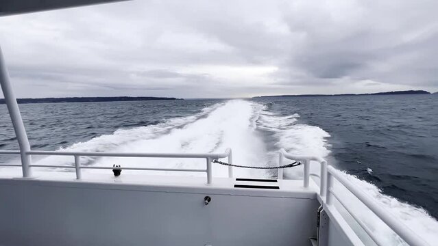 Boat trip across the ocean. Stern view. Wake of water