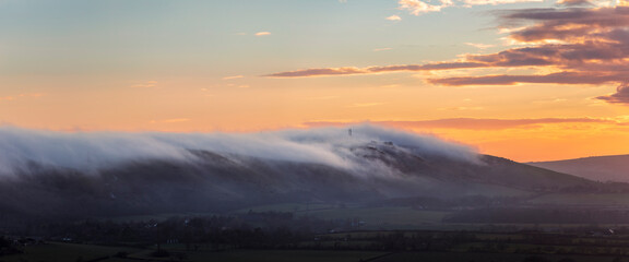 Low cloud and fog rolling in over Devils Dyke and the south downs from Newtimber Hill near Poynings West Sussex south east England UK