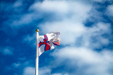 Flag of Faroe islands waving in the wind