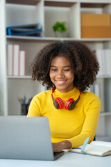 start-up business, young african woman american used laptop computer typing Search online for financial business information. Marketing from various applications at home office concept of living.