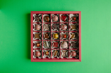 Handmade chocolates and candies on a bright colored background