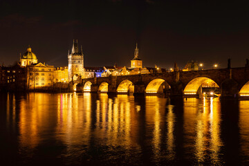 Obraz na płótnie Canvas Prague nightscape with the city skyline, landmark buildings, old town towers, and Charles Bridge over the Vltava River Czech Republic